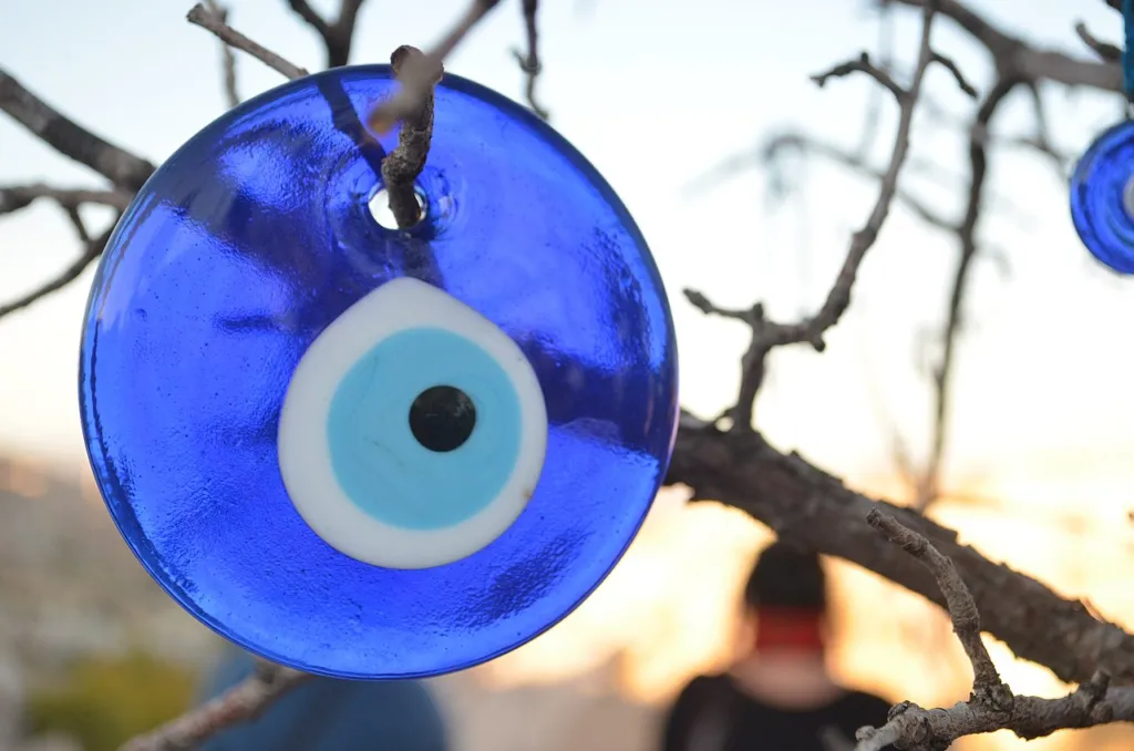 A nazar glass bead in Cappadocia, Turkey: the best-known emblem of the evil-eye belief that esfand smoke is also meant to ward off. The bead is glass, not harmal.