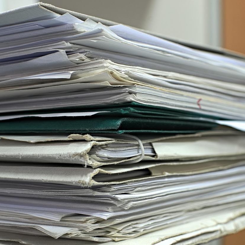 Stack of research papers and files