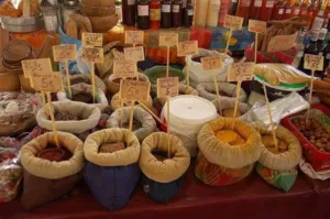 Stalls of spices and dried plant material in the market at Pointe a Pitre Guadeloupe