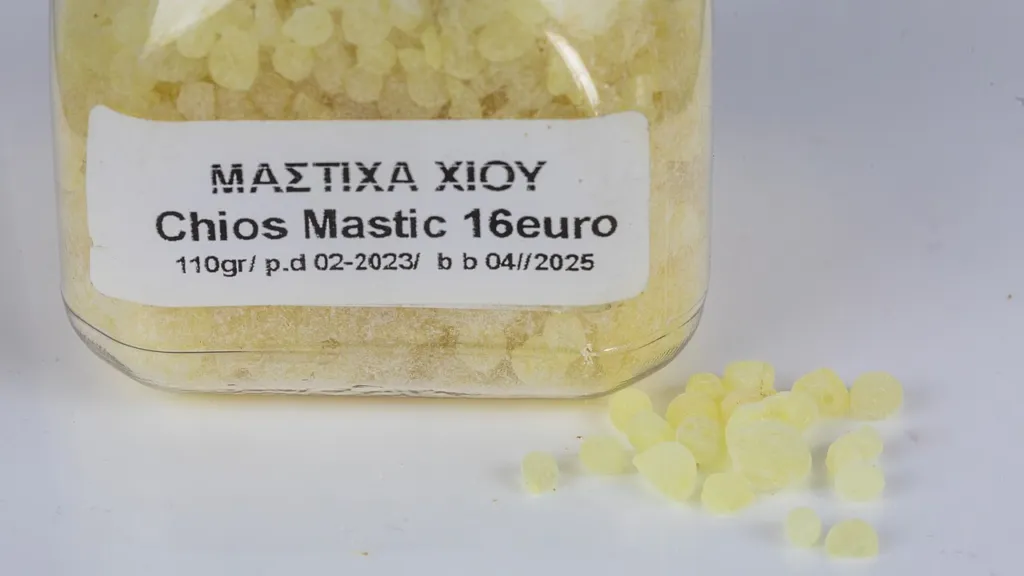 A jar of pale yellow Chios mastic tears