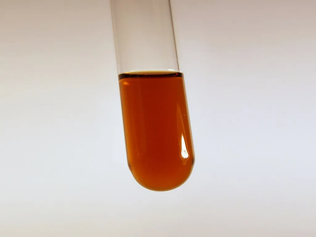 Test tube of dark amber Valeriana officinalis ethanol tincture