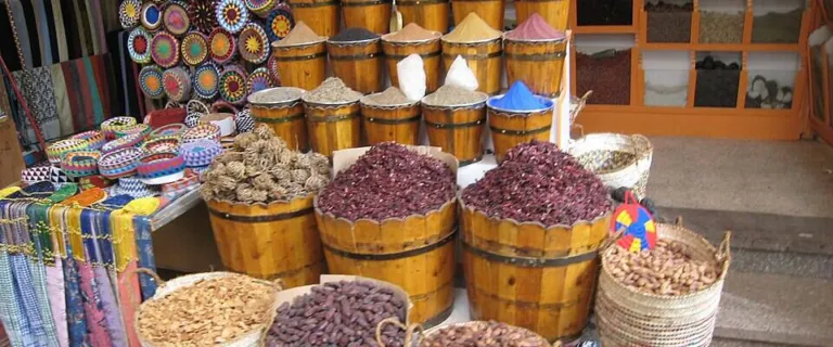 Market stall in Egypt with baskets of dried Hibiscus sabdariffa calyces sold as karkade