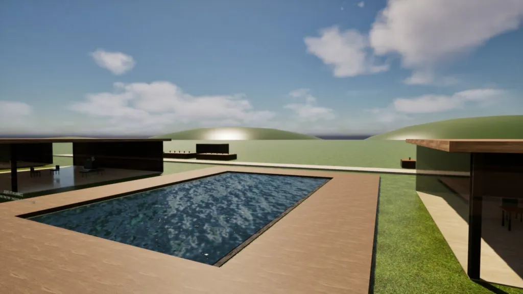 Village centre in the campus build: a timber-decked pool between pavilions, with green hills and sea behind